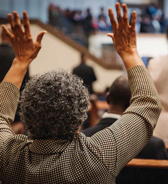 church members holding a donation basket